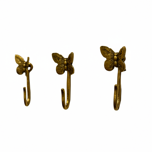Butterfly decorative metal push pin hooks in gold for hanging pictures, jewelry, photos, and lightweight decor.