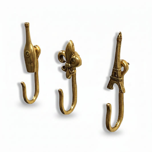Paris decorative metal push pin hooks in gold for hanging pictures, jewelry, photos, and lightweight decor.