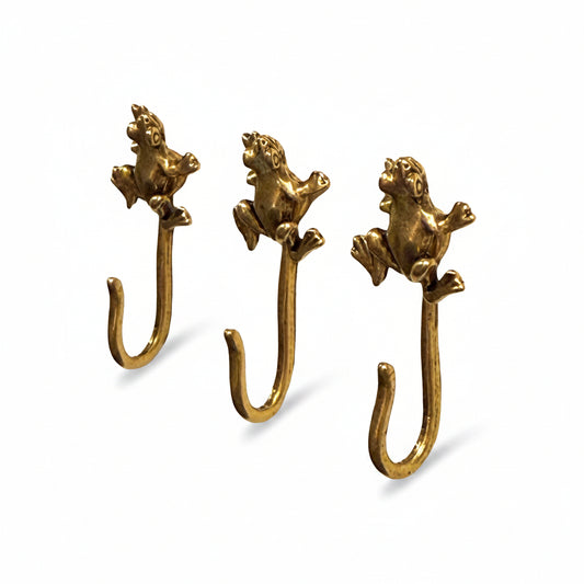 Frog decorative metal push pin hooks in gold for hanging pictures, jewelry, photos, and lightweight decor. 