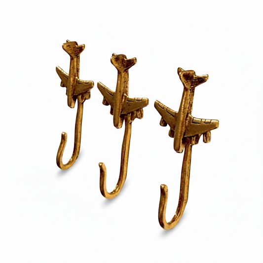 Jet decorative metal push pin hooks in gold for hanging pictures, jewelry, photos, and lightweight decor. 